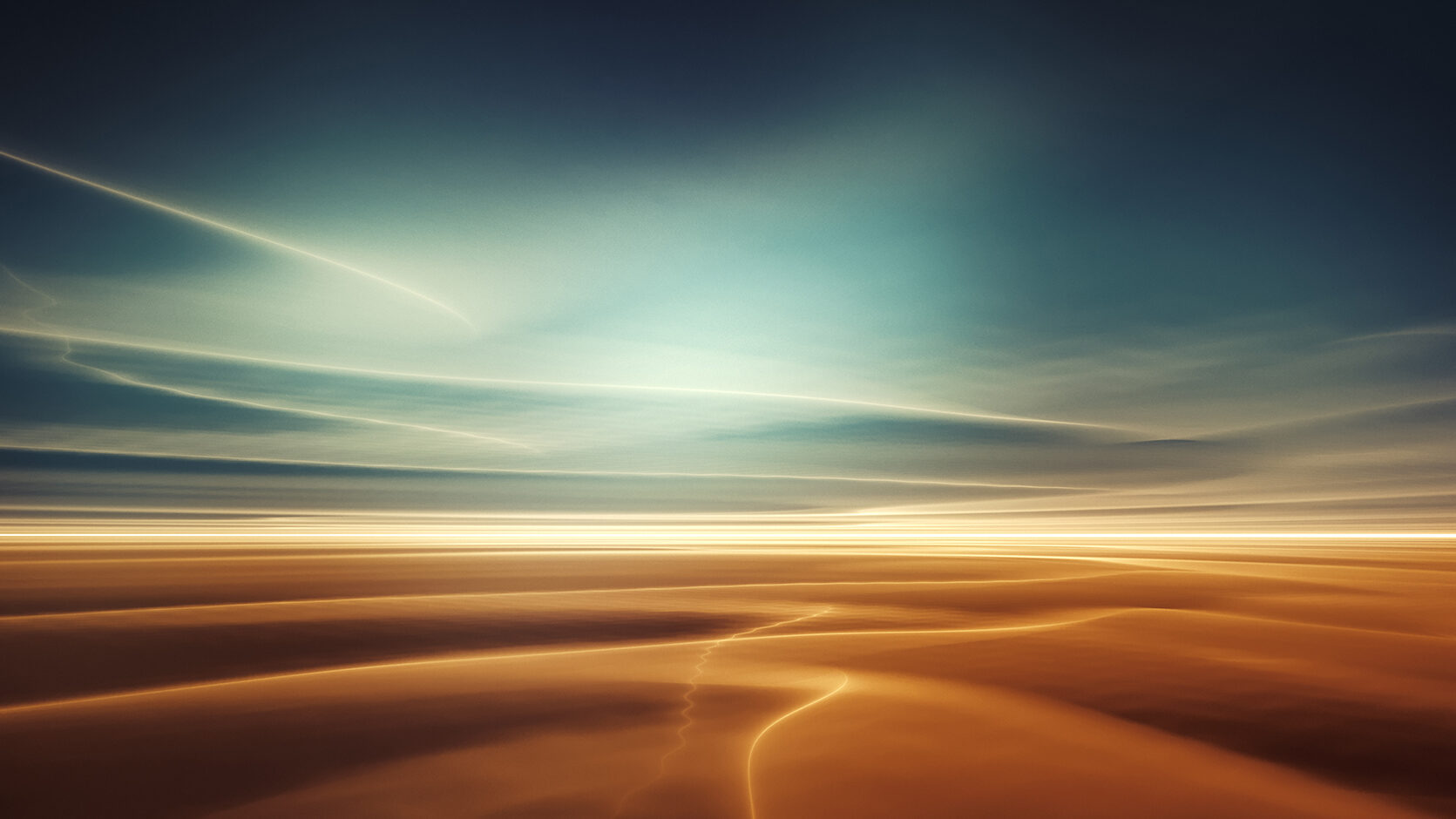 Picture of orange sand meeting blue sky at the horizon line